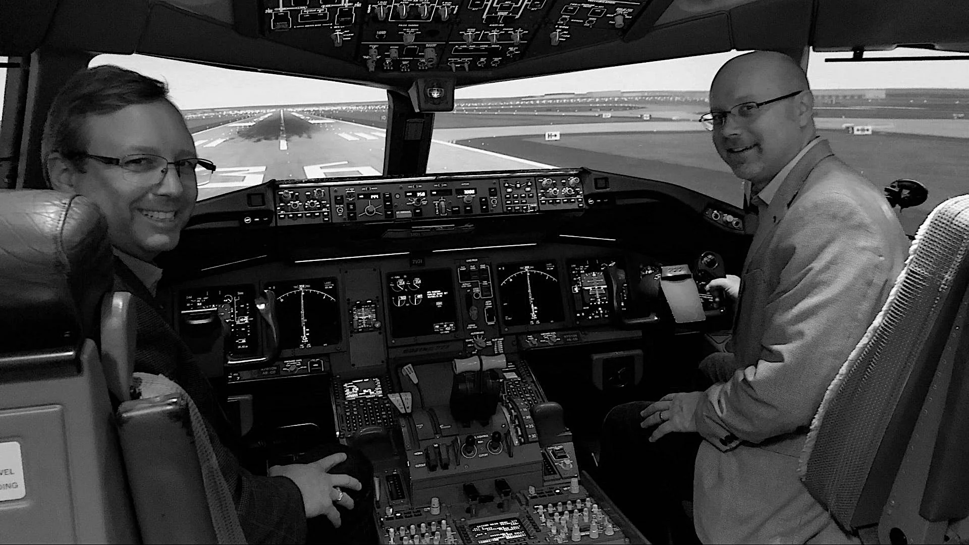 Lextech team in a Boeing 777 flight deck facing the runway